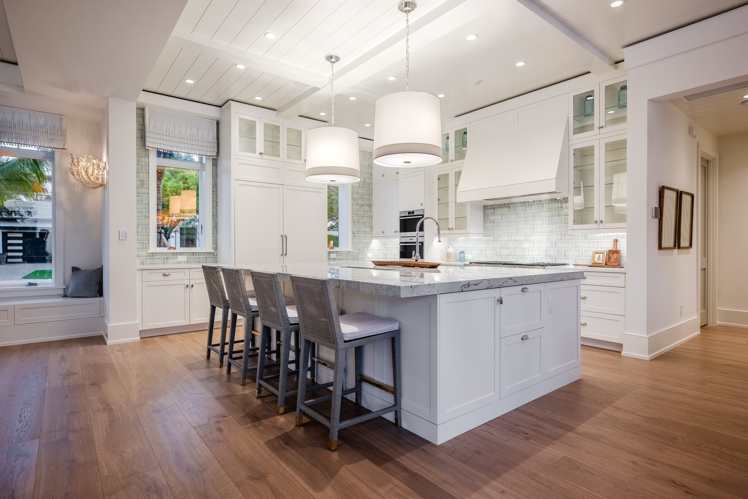 Old Naples Transitional kitchen, white inset cabinetry, quartzite island and shiplap ceiling