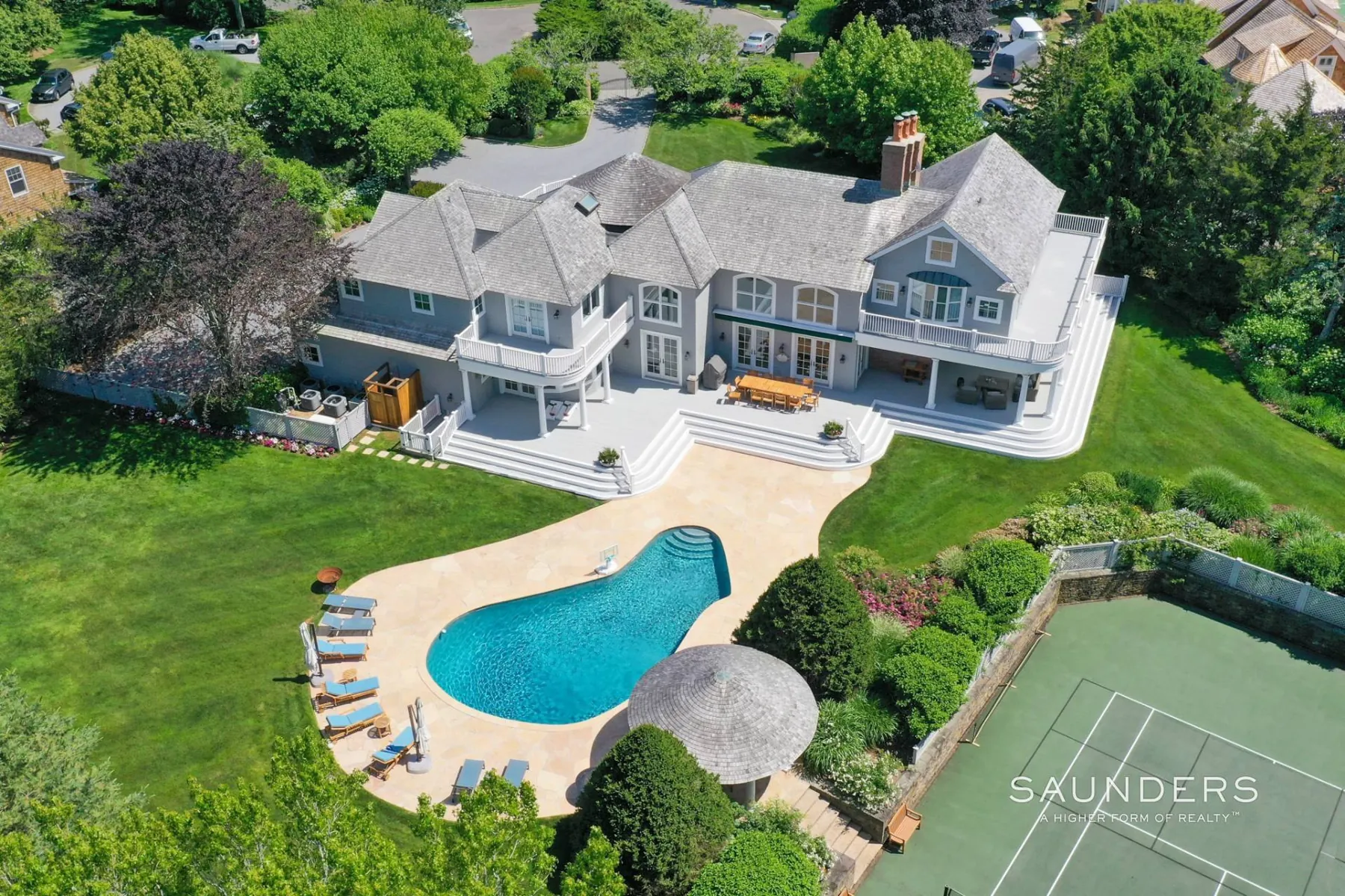 The pool, pool house gazebo and tennis court from above